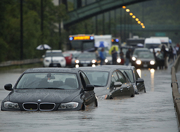 Three cars were swamped on the DVP following a rain storm in July of 2013 (photo by Randy Risling/Toronto Star via Getty Images)