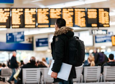 Man looking at train arrival times
