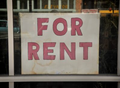 For rent sign on display in a window