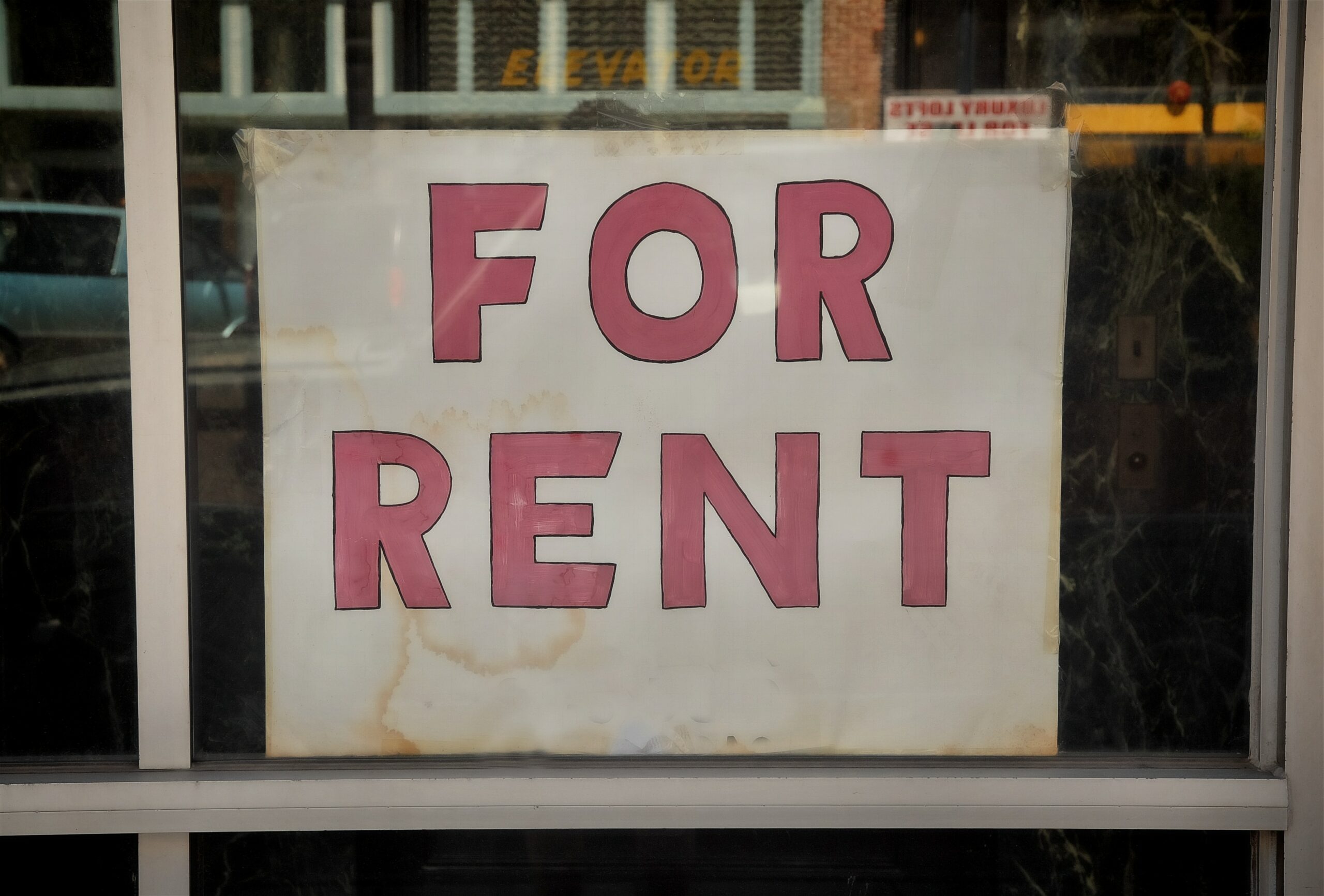 For rent sign on display in a window