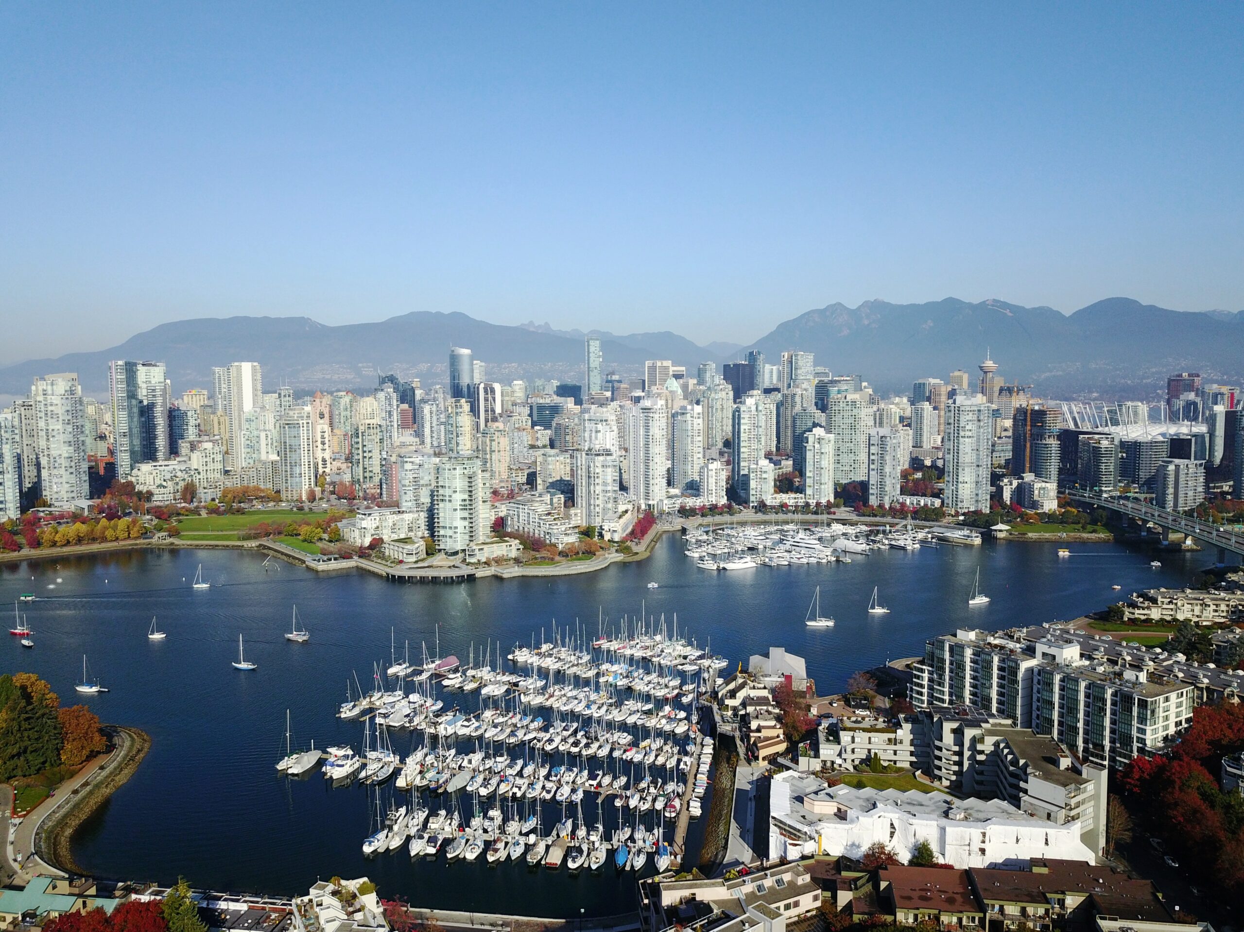 Arial photo of Vancouver harbour, boats and downtown buildings