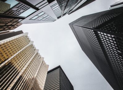 Looking up at multiple Toronto skyscrapers from below