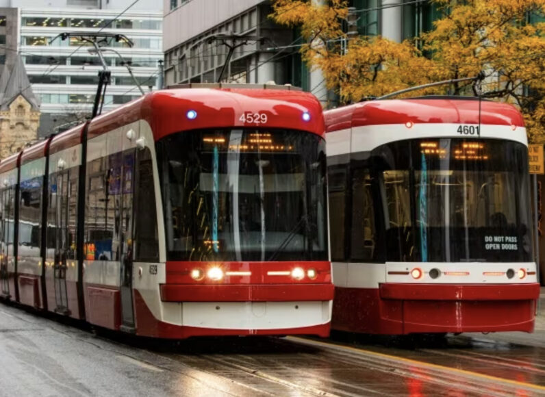 Two King St streetcars pass each other