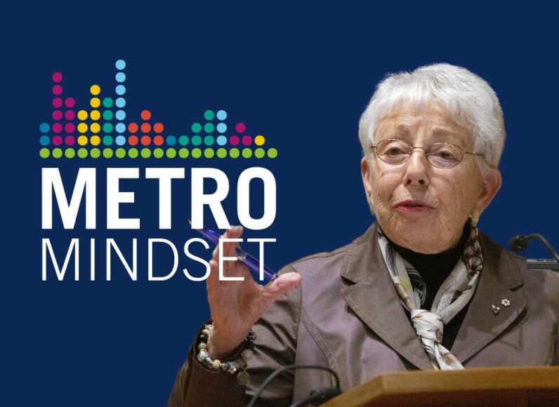 Dr. Anne Golden on a podium. Metro Mindset logo.