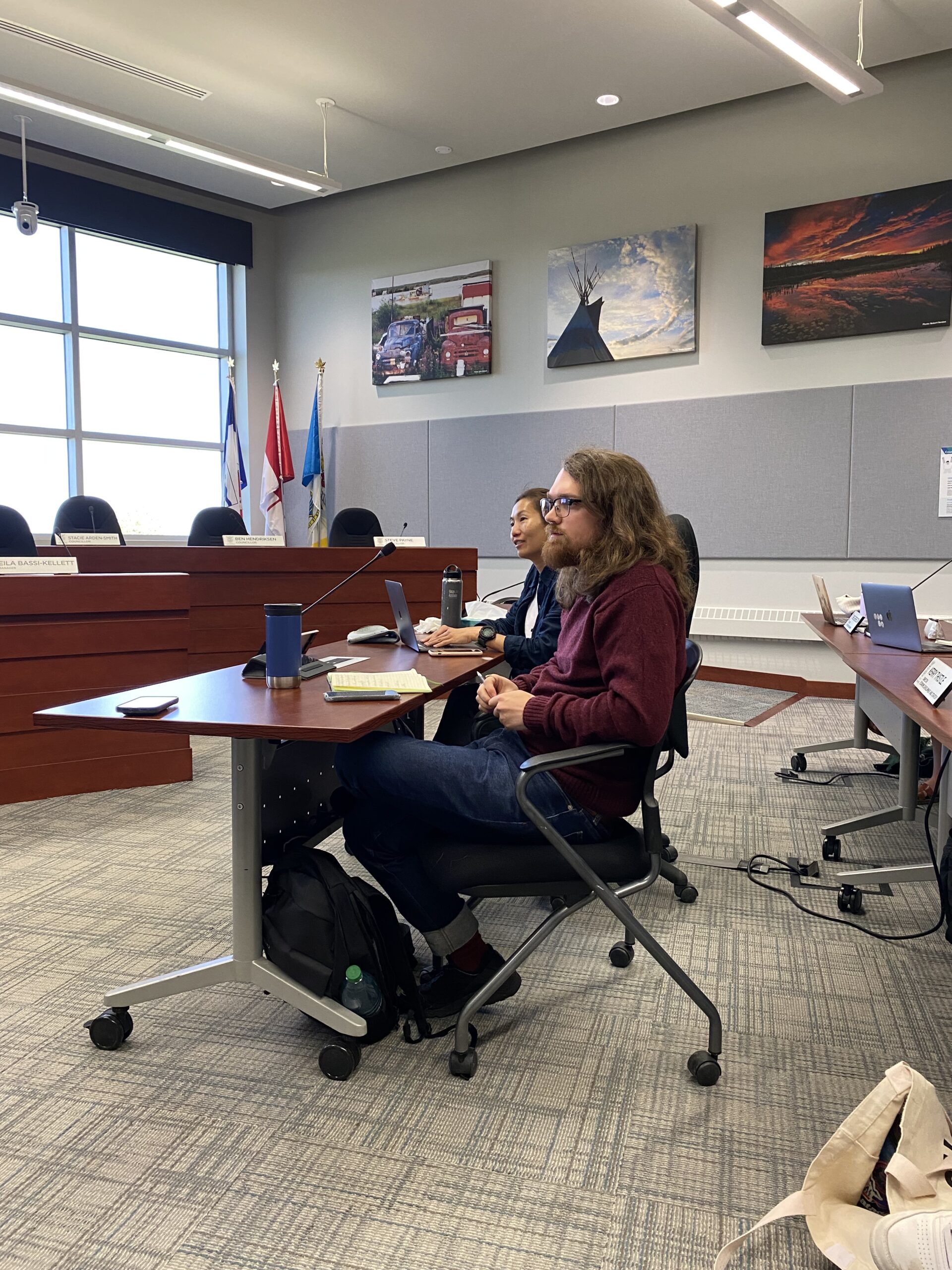 Two students seated in Yellowknife council chambers