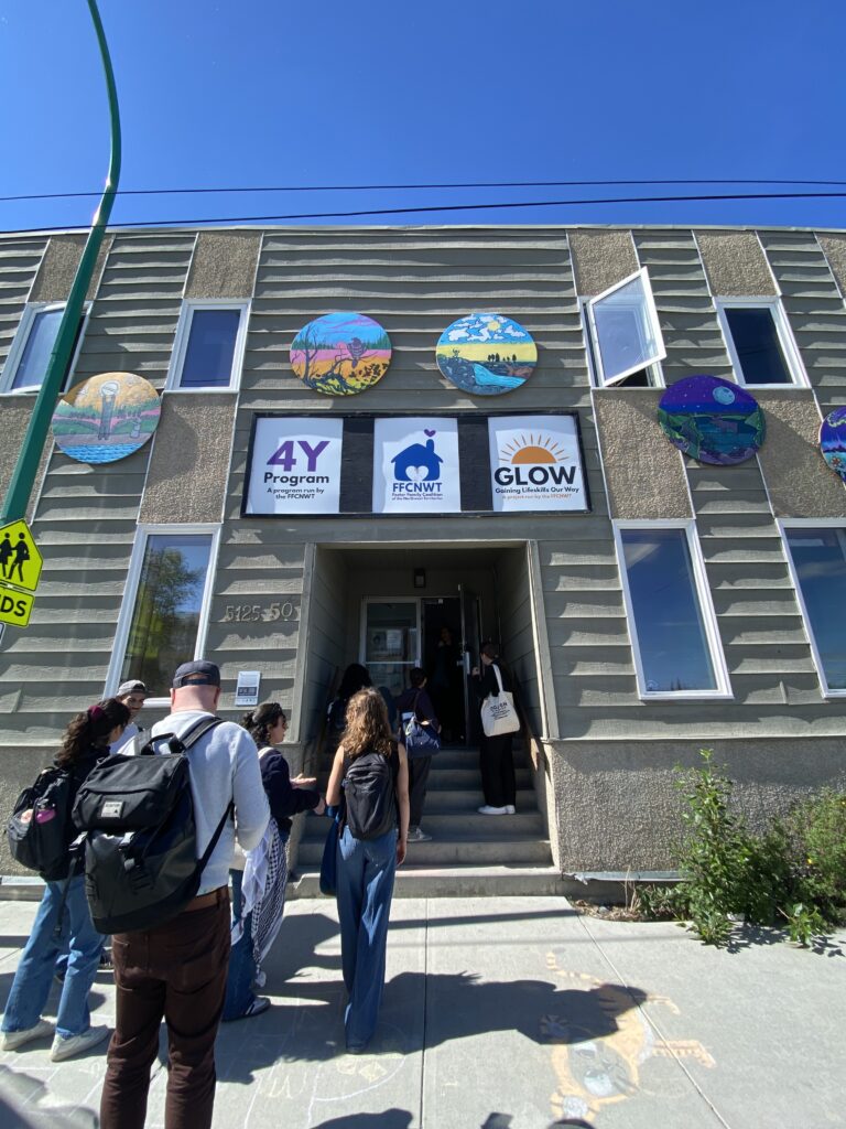 Students entering Home Base building from oustide