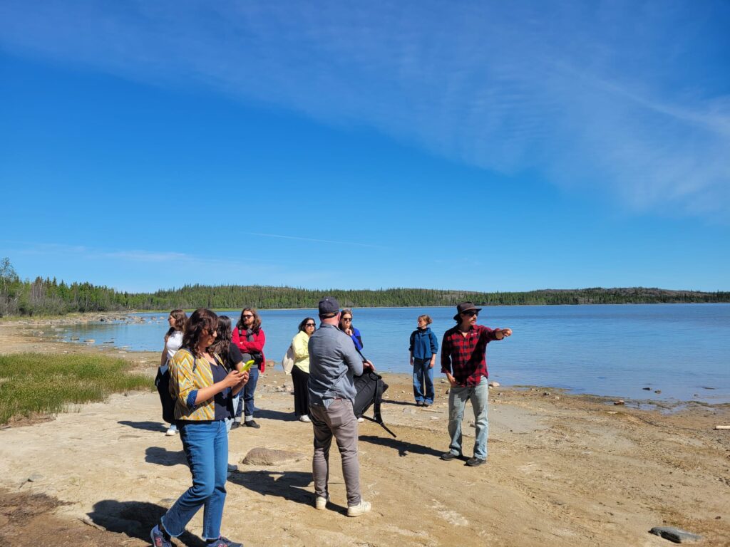 Students look across Yellowknife shoreline