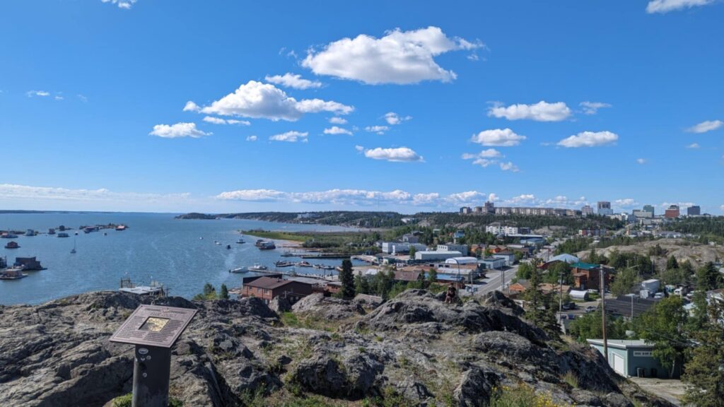 Wide photograph of Yellowknife's Old Town waterfront and buildings